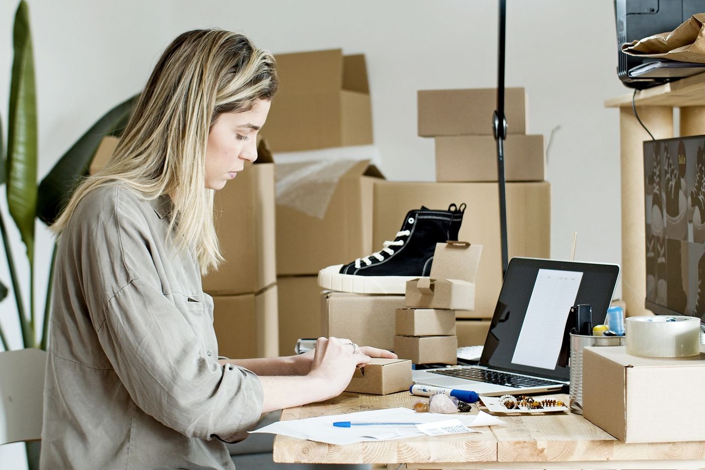 Small business owner preparing online orders